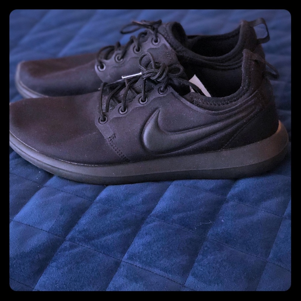 Woman’s Black Nike’s